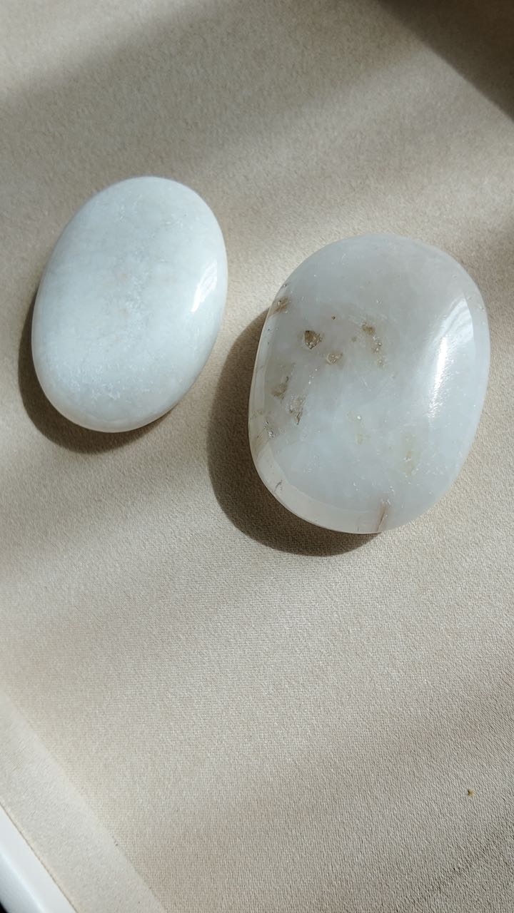 Scolecite palm stones from India, white and cream, cut to be held