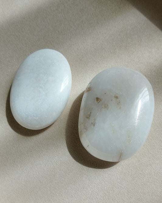 Scolecite palm stones from India, white and cream, cut to be held