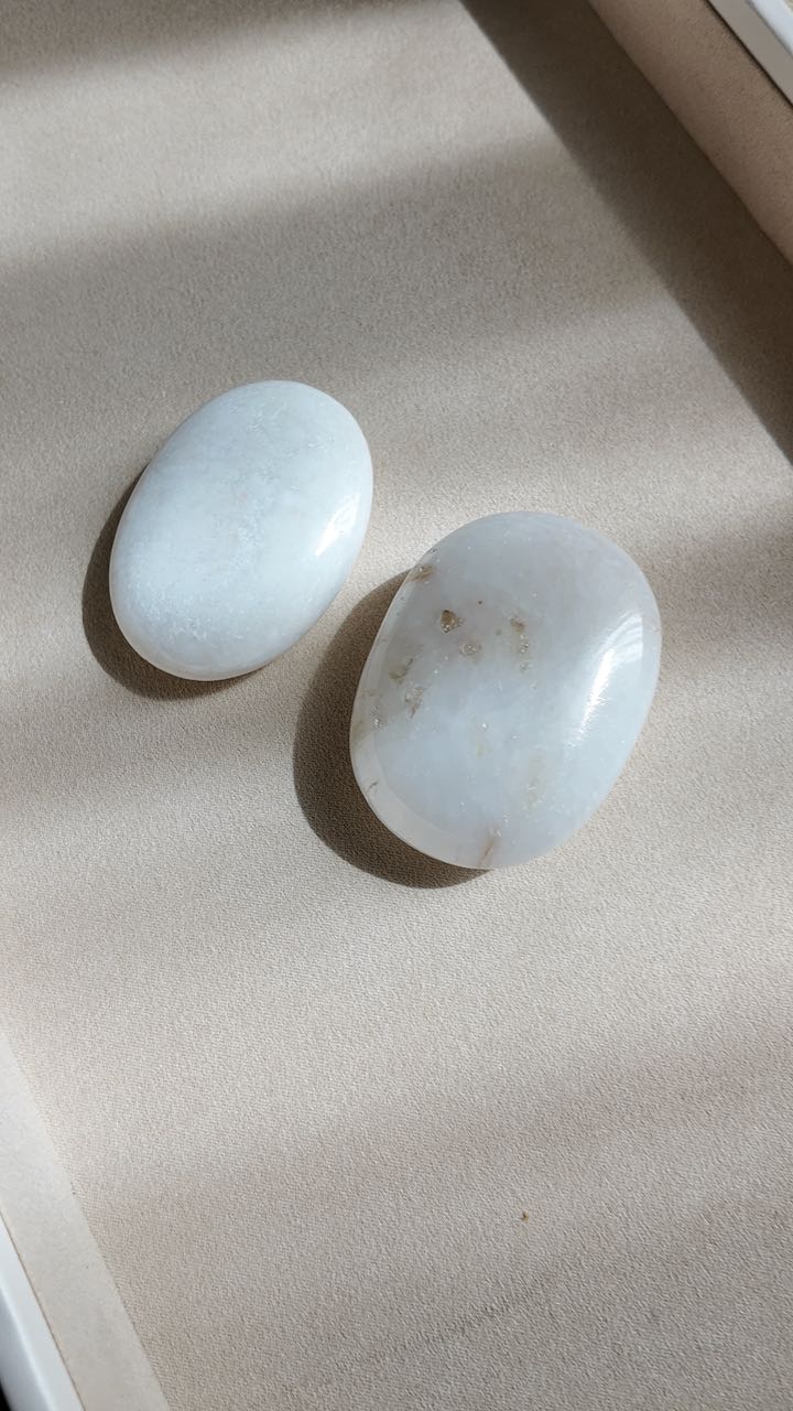 The two scolecite palm stones seen from above in raking window light