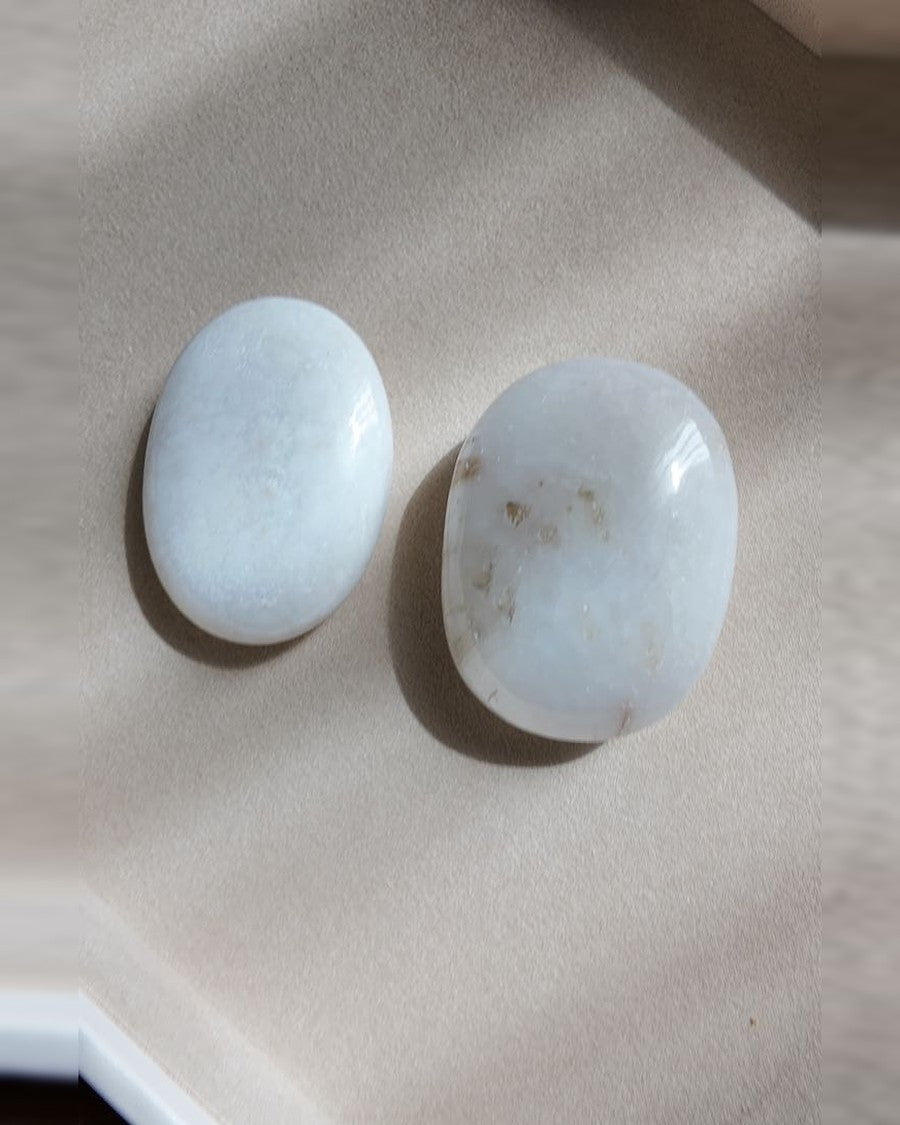 QUIET scolecite palm stones on cream tray