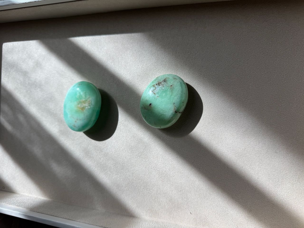 The pair of chrysoprase palm stones photographed from above