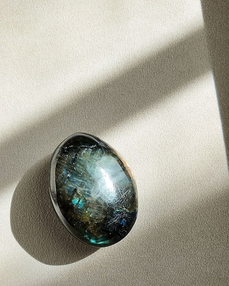 UNDERESTIMATED labradorite palm stone on cream tray