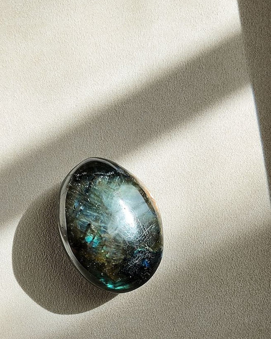 UNDERESTIMATED labradorite palm stone on cream tray