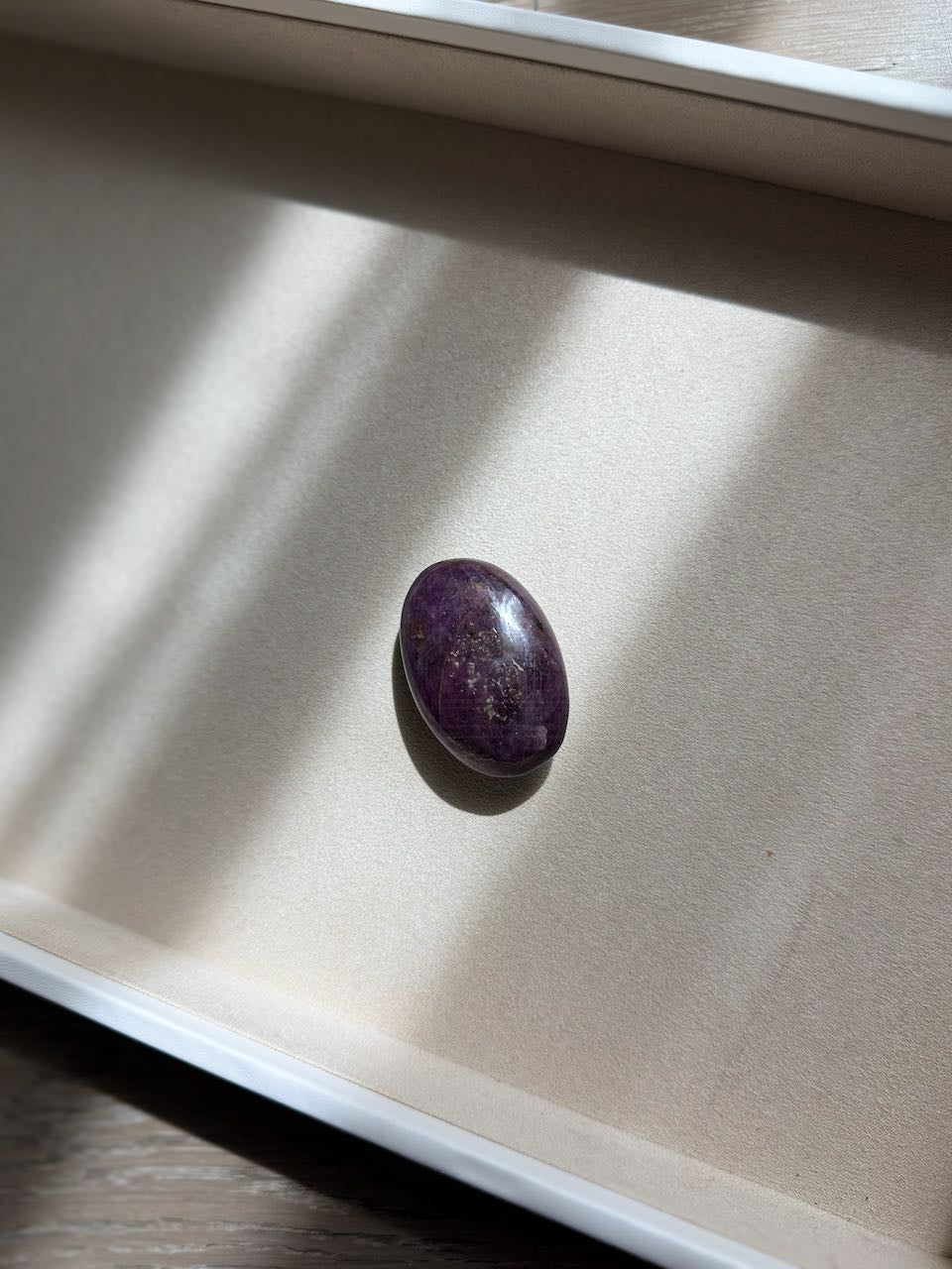 Ruby palm stone, deep red and unpolished, seen from above