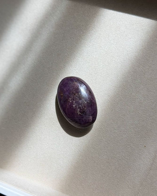 Ruby palm stone, deep red and unpolished, seen from above