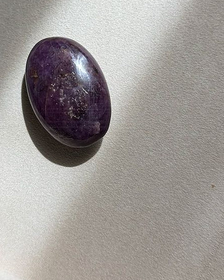 UNSHAKEN ruby palm stone on cream tray