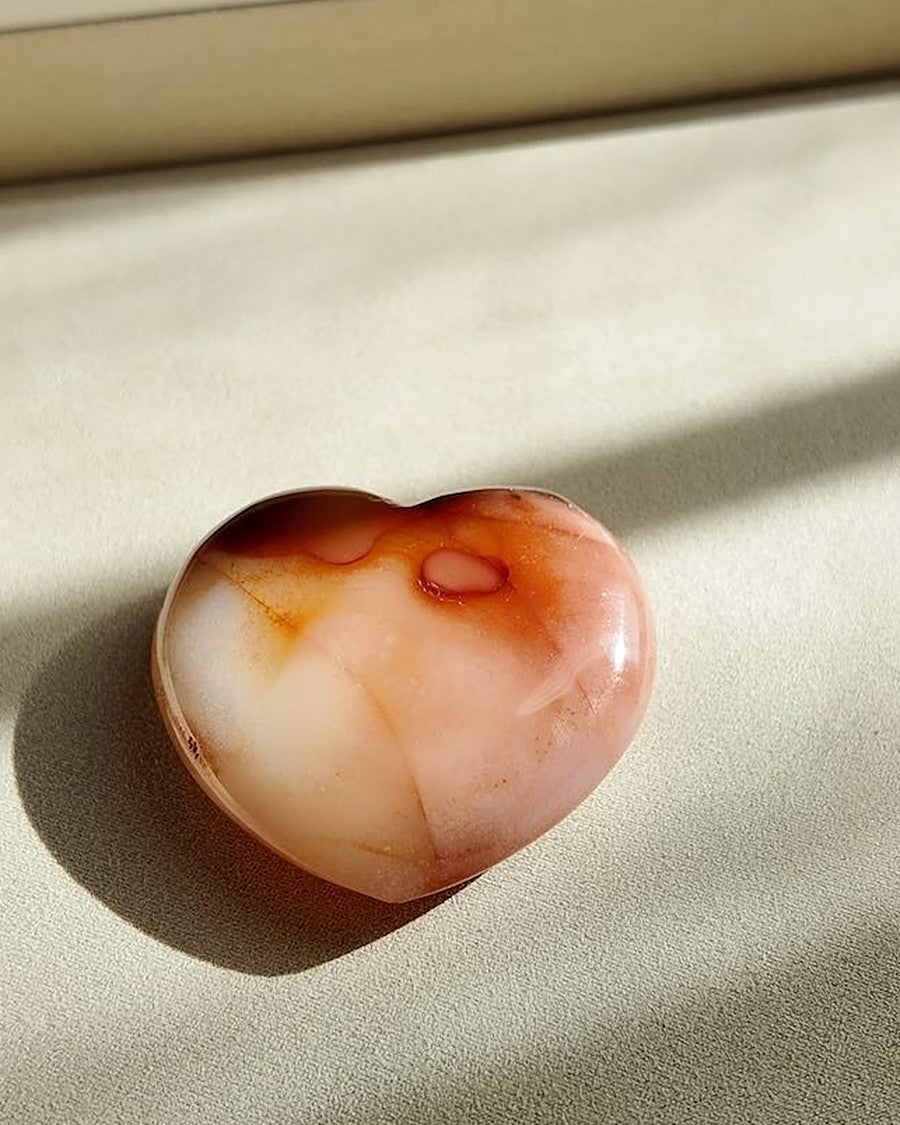 WANTING carnelian palm stone on cream tray